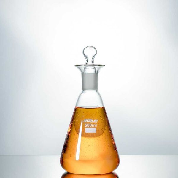 500 ml laboratory flask containing amber-colored liquid