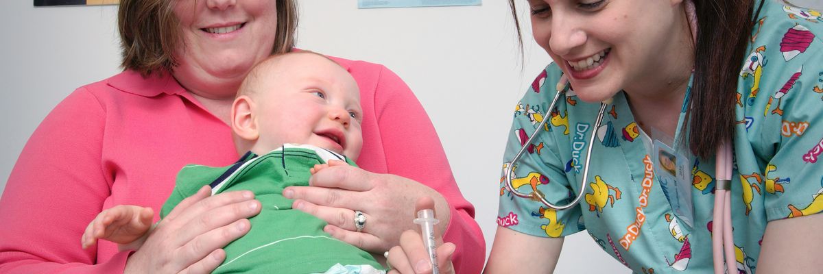 A baby receives a vaccine