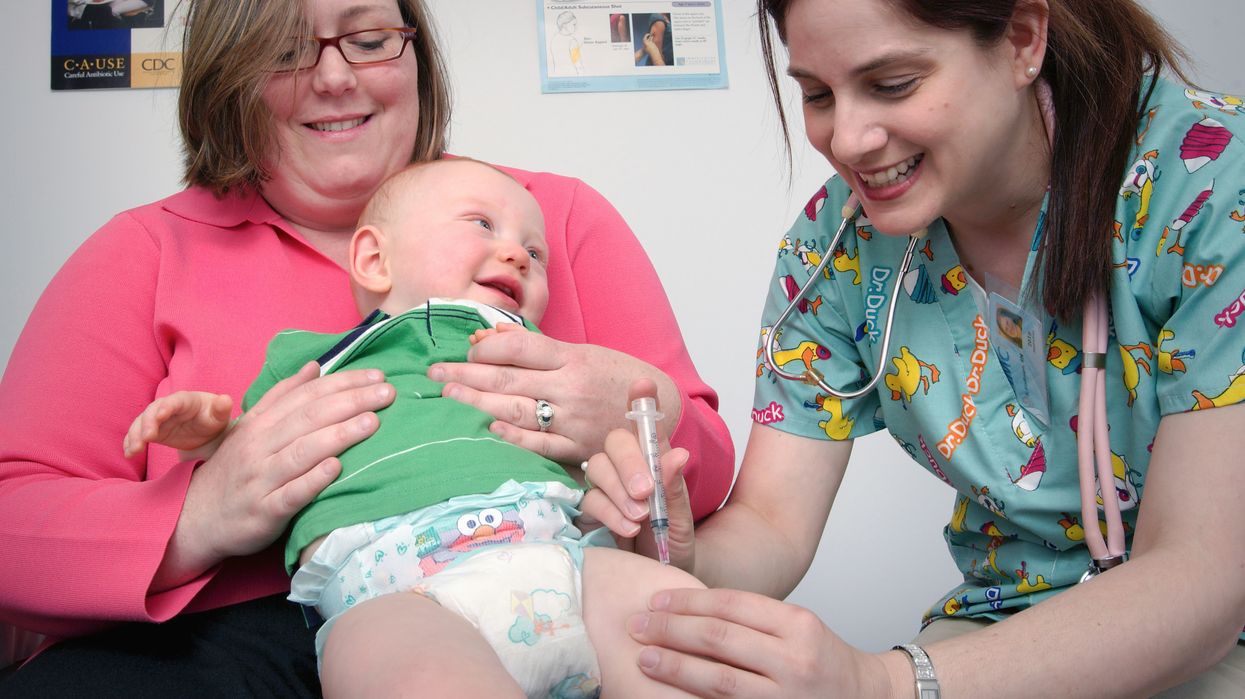 A baby receives a vaccine