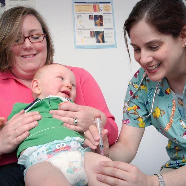 A baby receives a vaccine
