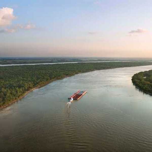 A barge making its way down a river