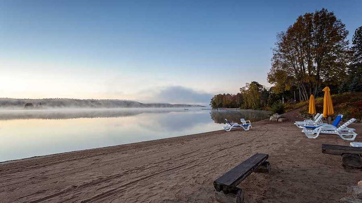 A beach on a misty lake