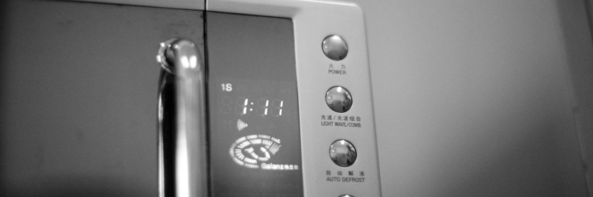 a black and white photo of a microwave