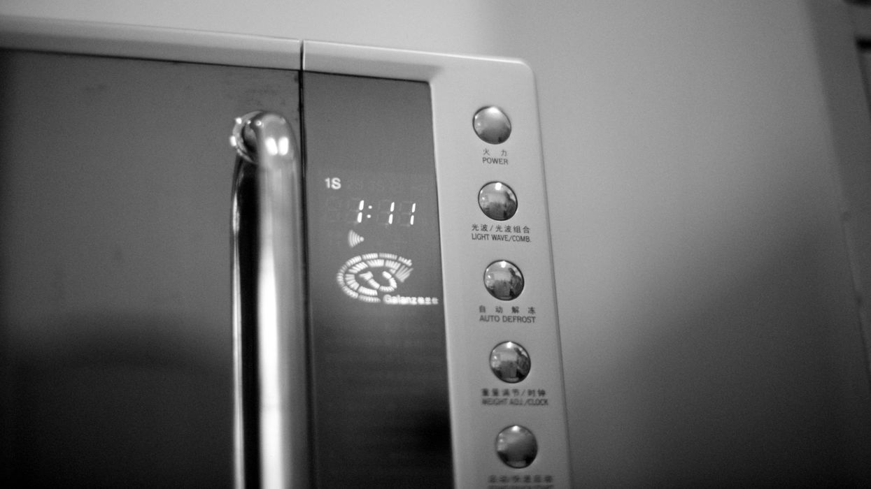 a black and white photo of a microwave