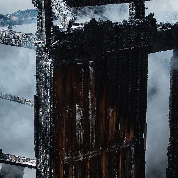 A blackened shell of a burned home.