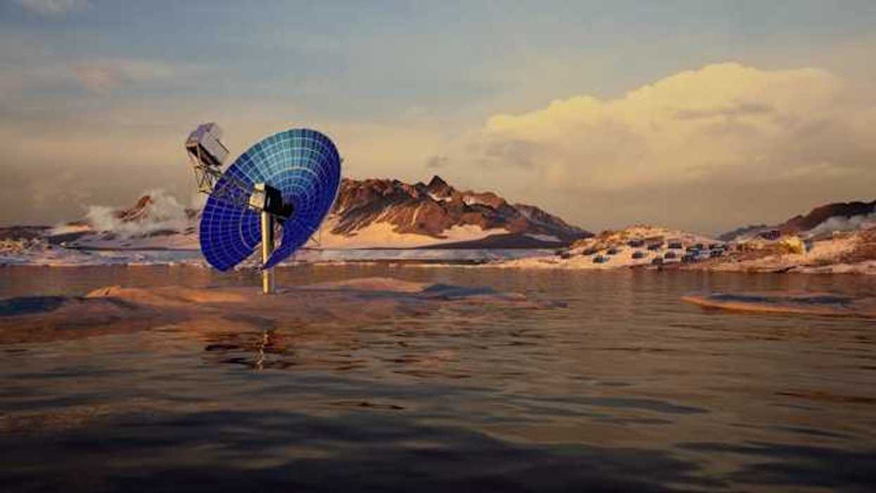 A blue satellite dish in a snowy landscape pointed at the sky