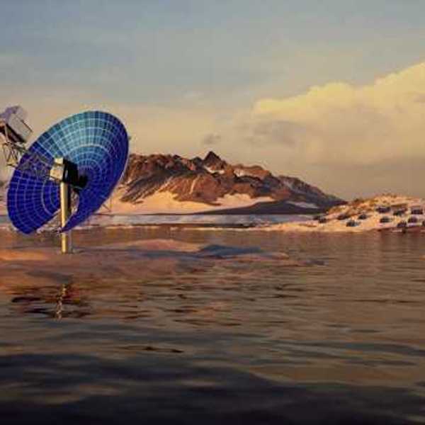 A blue satellite dish in a snowy landscape pointed at the sky
