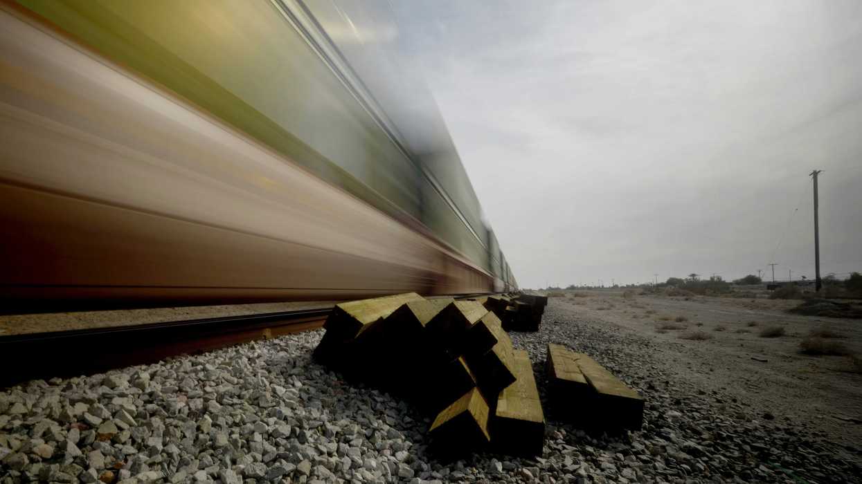 A blurry photo of a train going by.