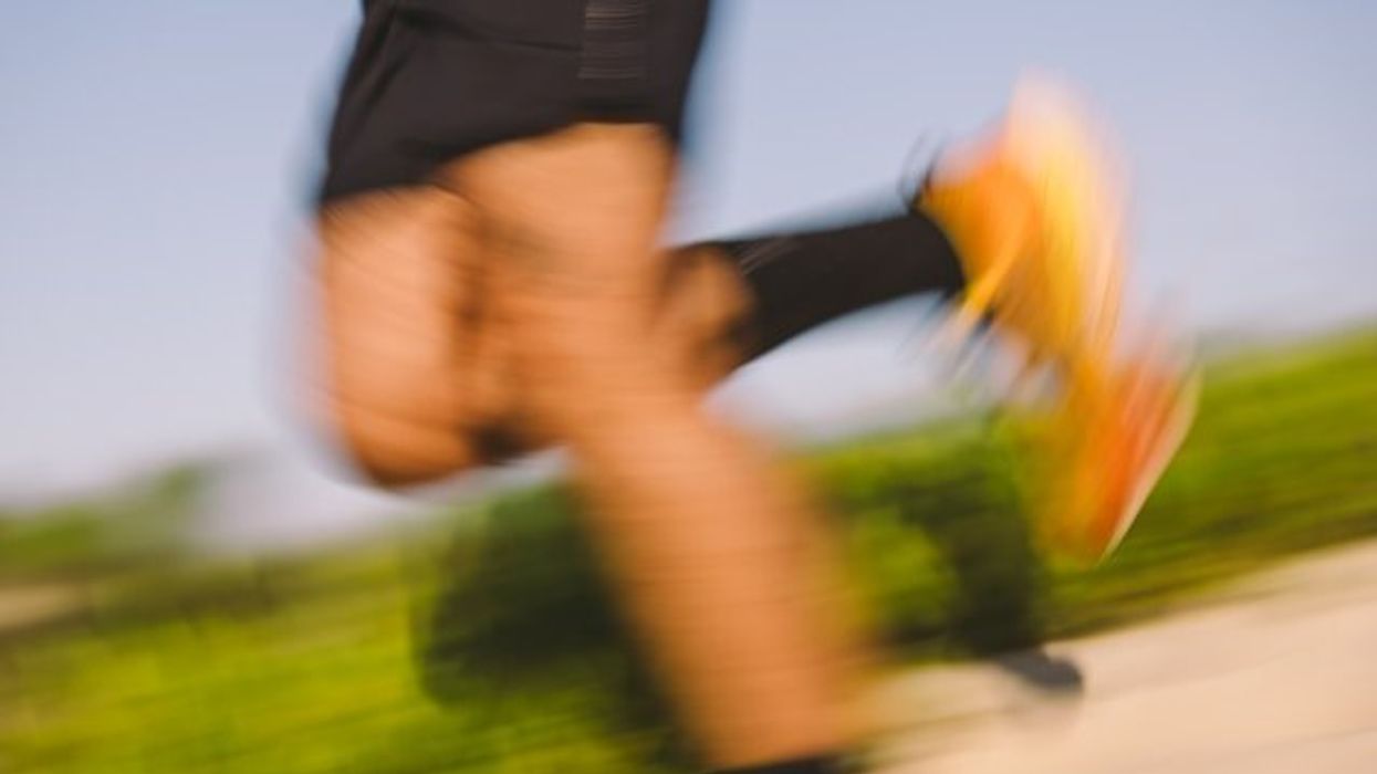 A blurry picture of a jogger's legs.