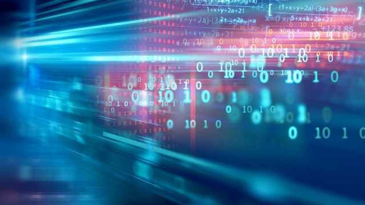 A blurry view of a computer screen with 1's and 0's on it