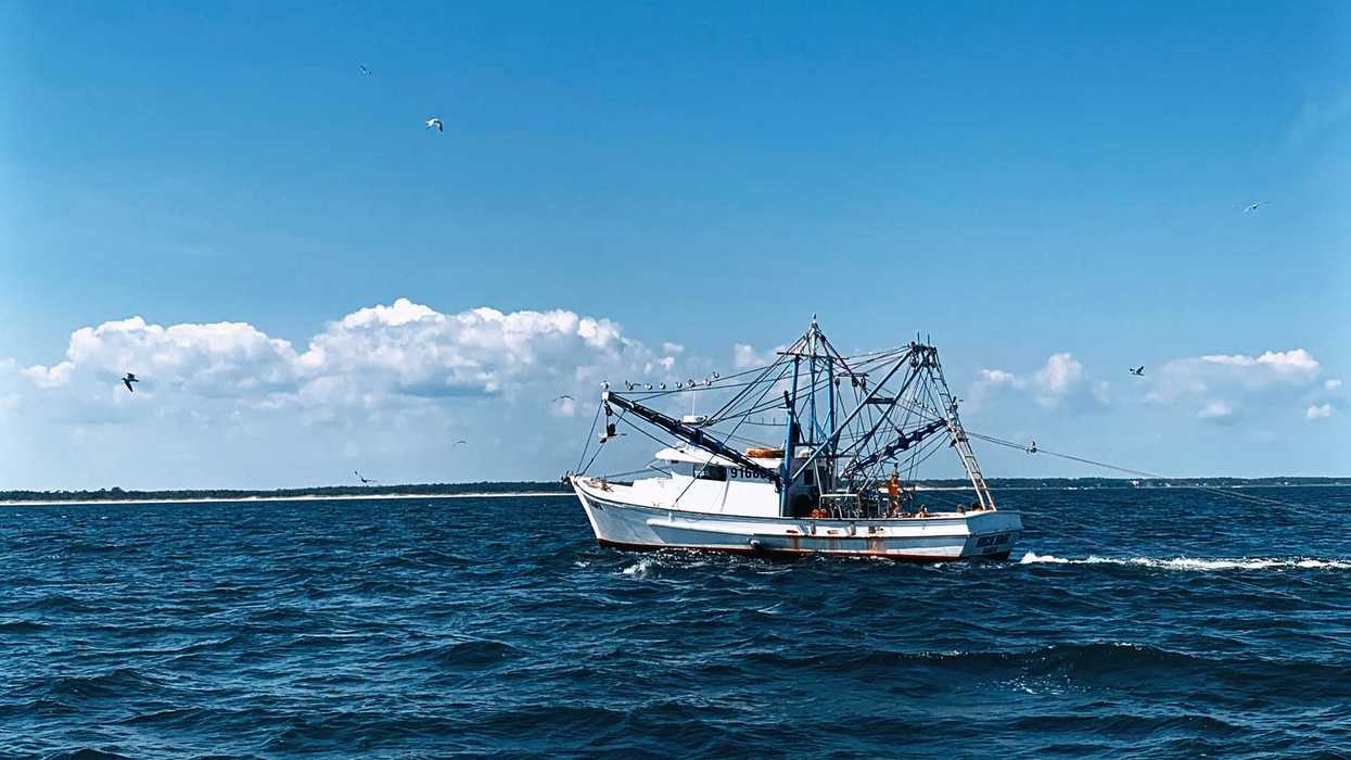 a boat sailing on the sea.