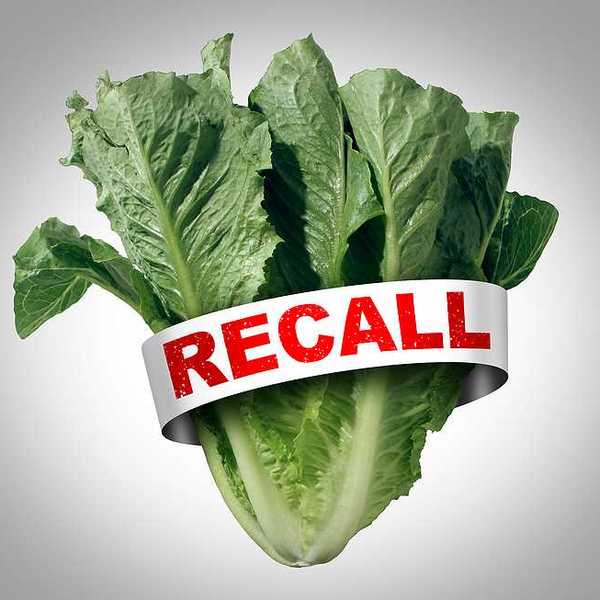 A bunch of lettuce with a tag with the word RECALL in red font