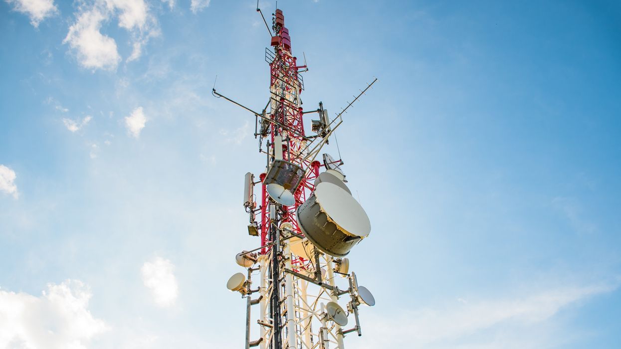 A cell tower against a blue sky