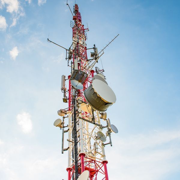A cell tower against a blue sky