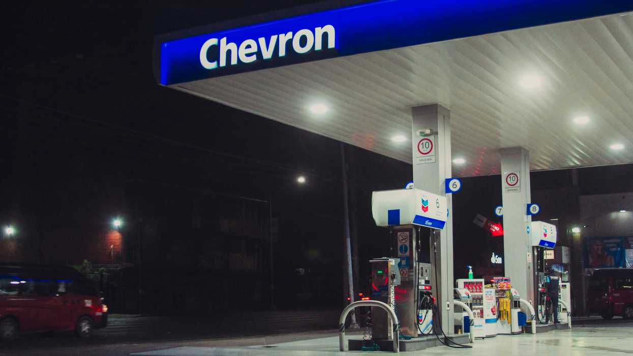 a chevron gas station at night time.