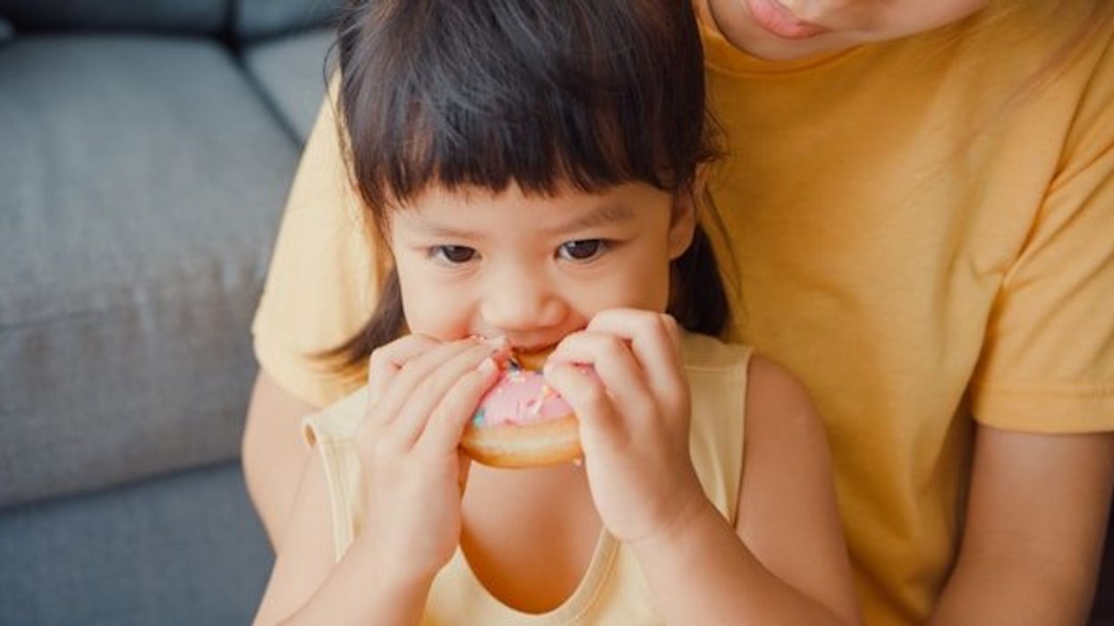 A child eating a donut