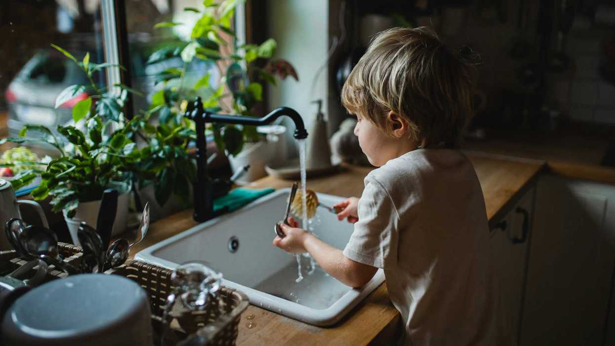 A child plays in sink water