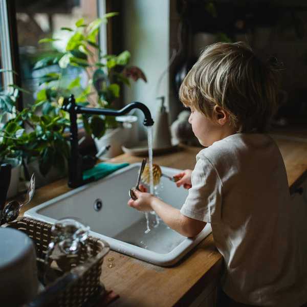 A child plays in sink water