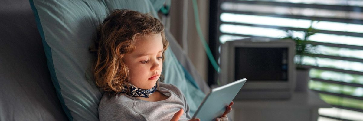 A child uses a wireless tablet
