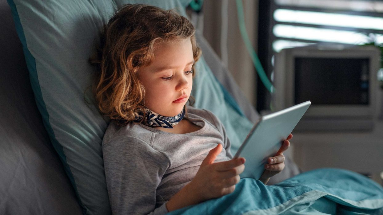 A child uses a wireless tablet