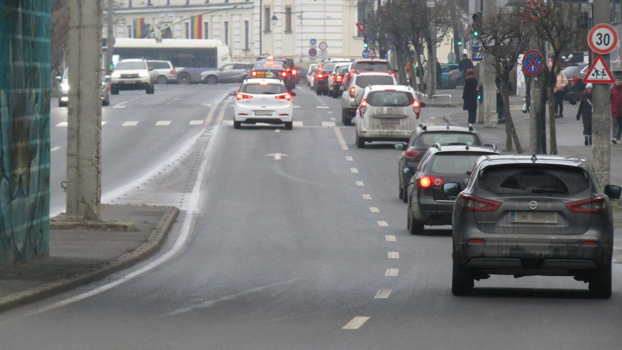 A city street filled with lots of traffic.