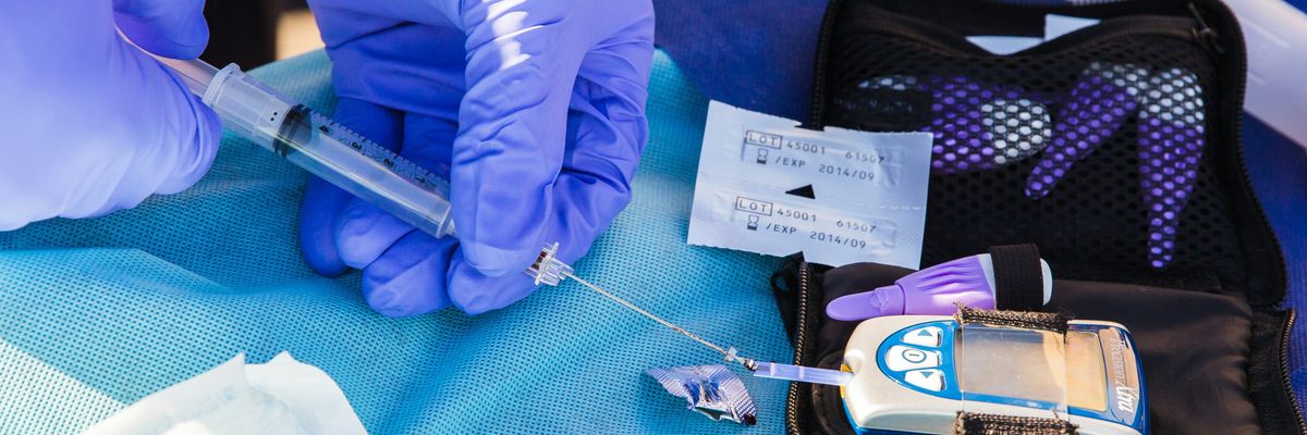 A clinician conducts an insulin level test