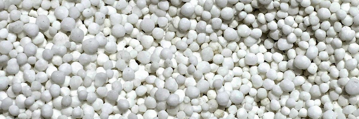 a close up of a bunch of white plastic pellets.