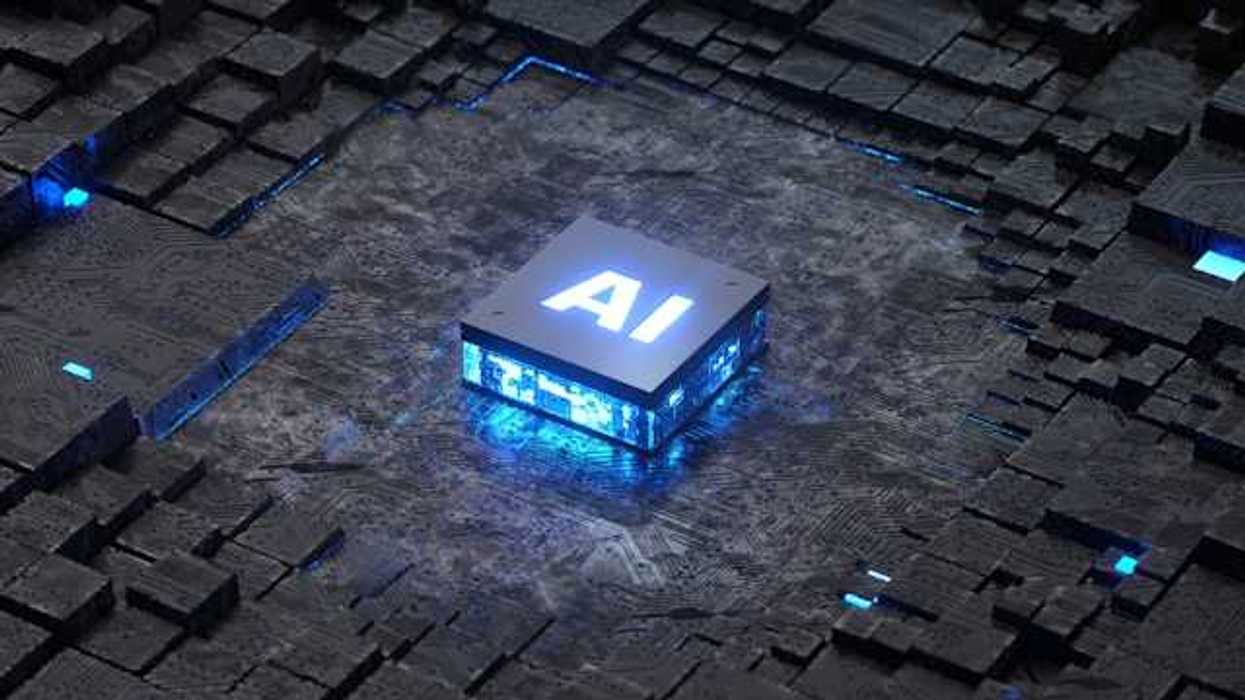 A closeup of a computer mother board with a blue and black square with the letters AI on it