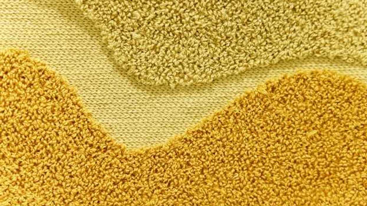 A closeup of yellow carpet