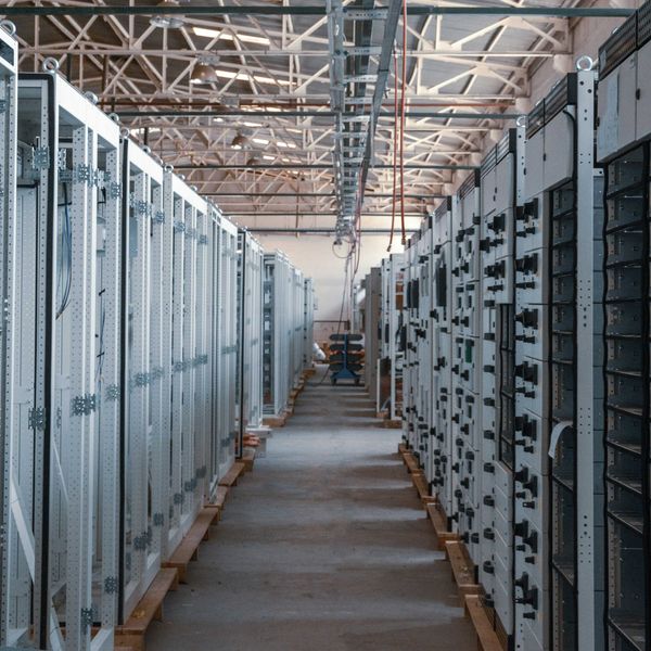 A data center with rows of servers stretching into the distance