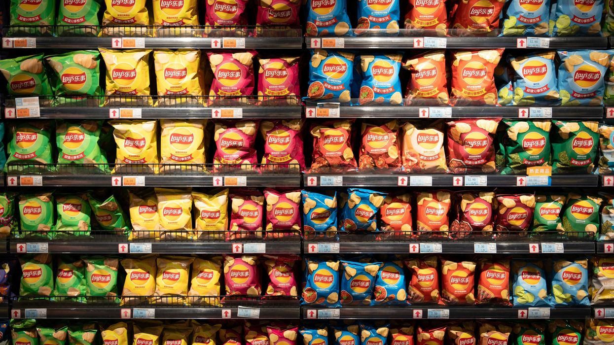 a display in a store filled with rows of potato chips