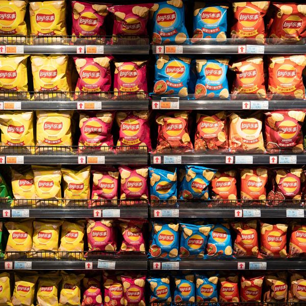a display in a store filled with rows of potato chips