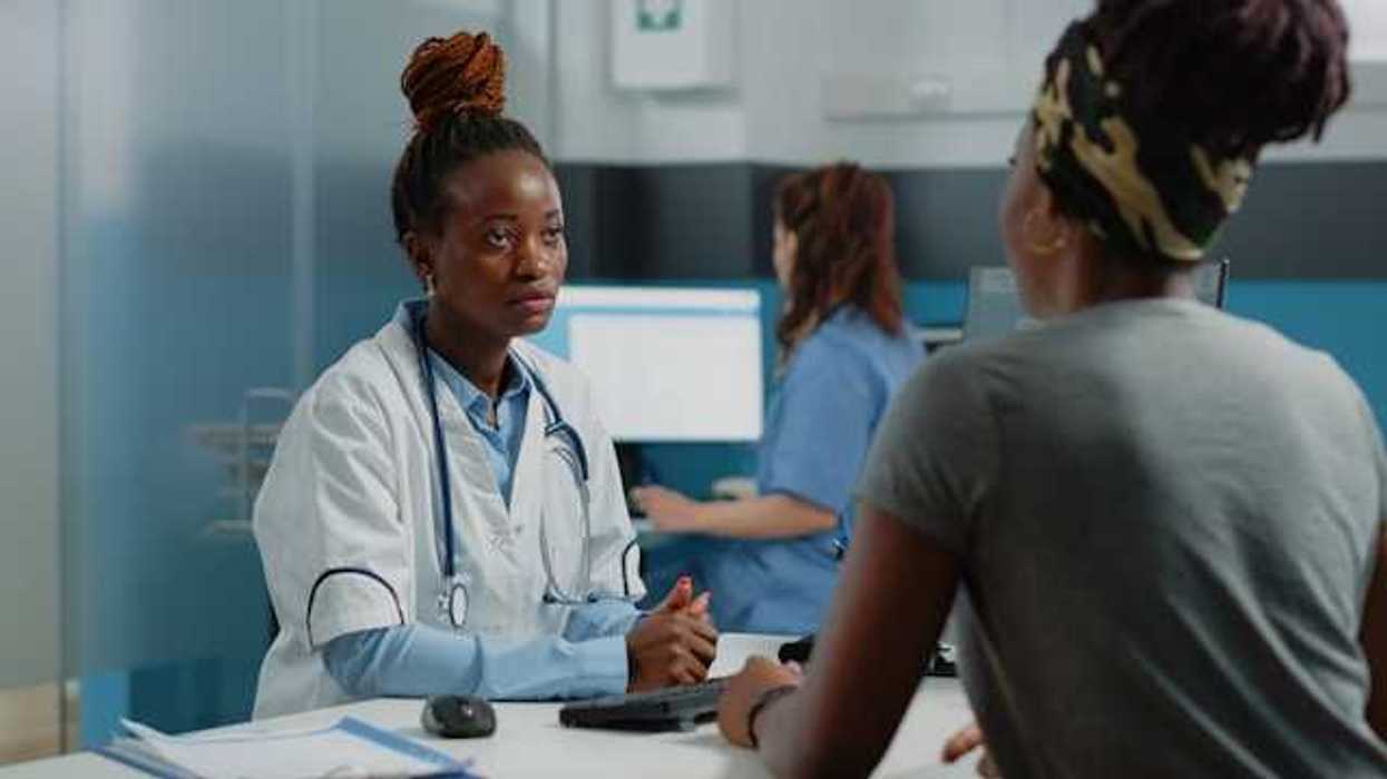 A doctor talking to a patient