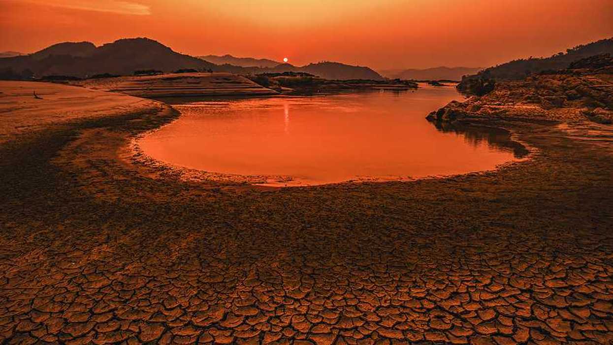 A drying lakebed under a setting sun