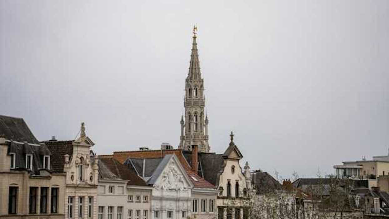 A European city with tall buildings and a church steeple