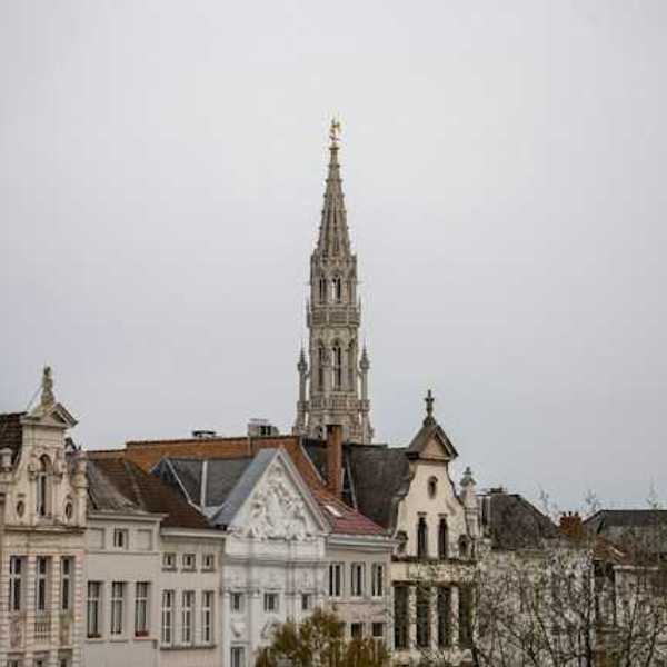A European city with tall buildings and a church steeple