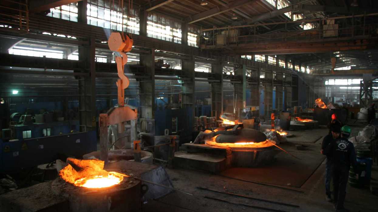 a factory with a lot of steel being made.