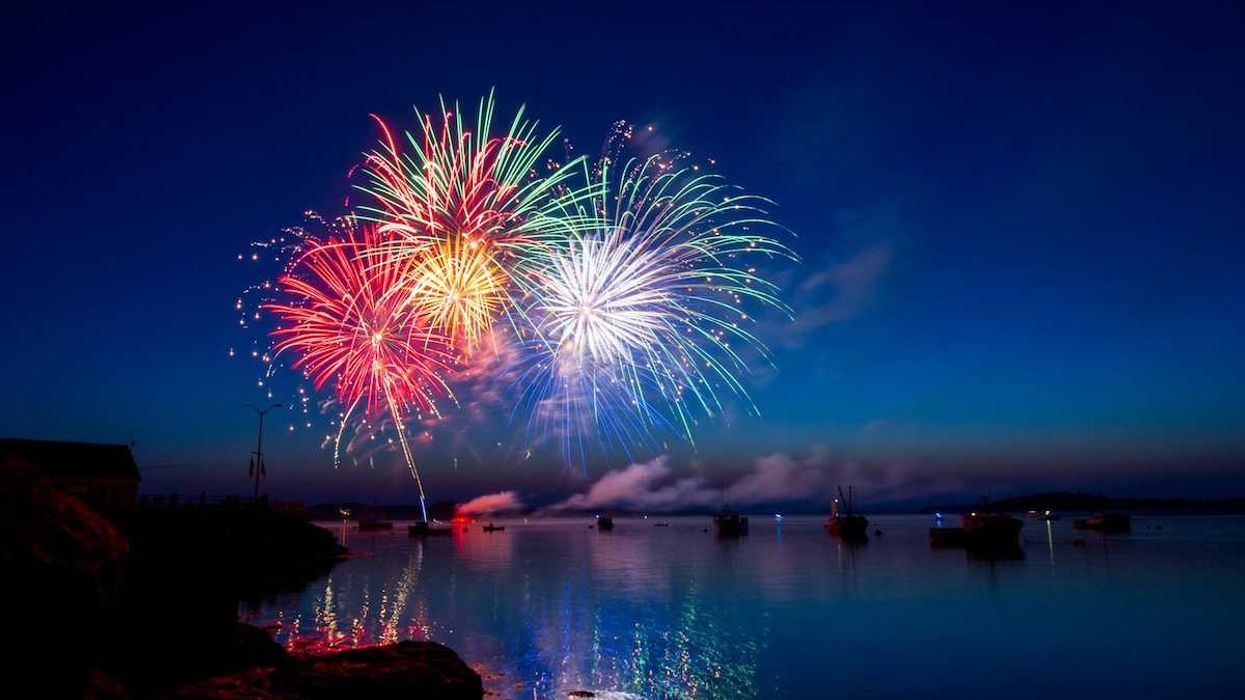 A fireworks display in the harbor of Lubec Maine. The dusk sky, water and boats provided a beautiful setting for the colorful show.