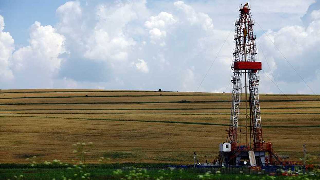 A fracking well next to a farm field
