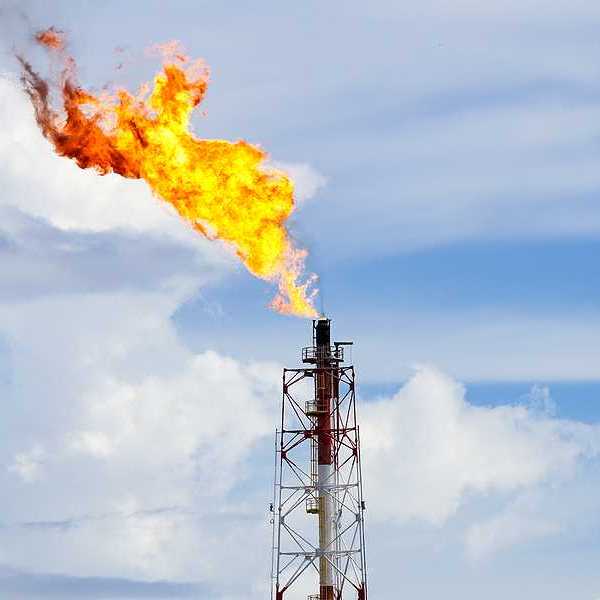 A gas flare at an oil refinery