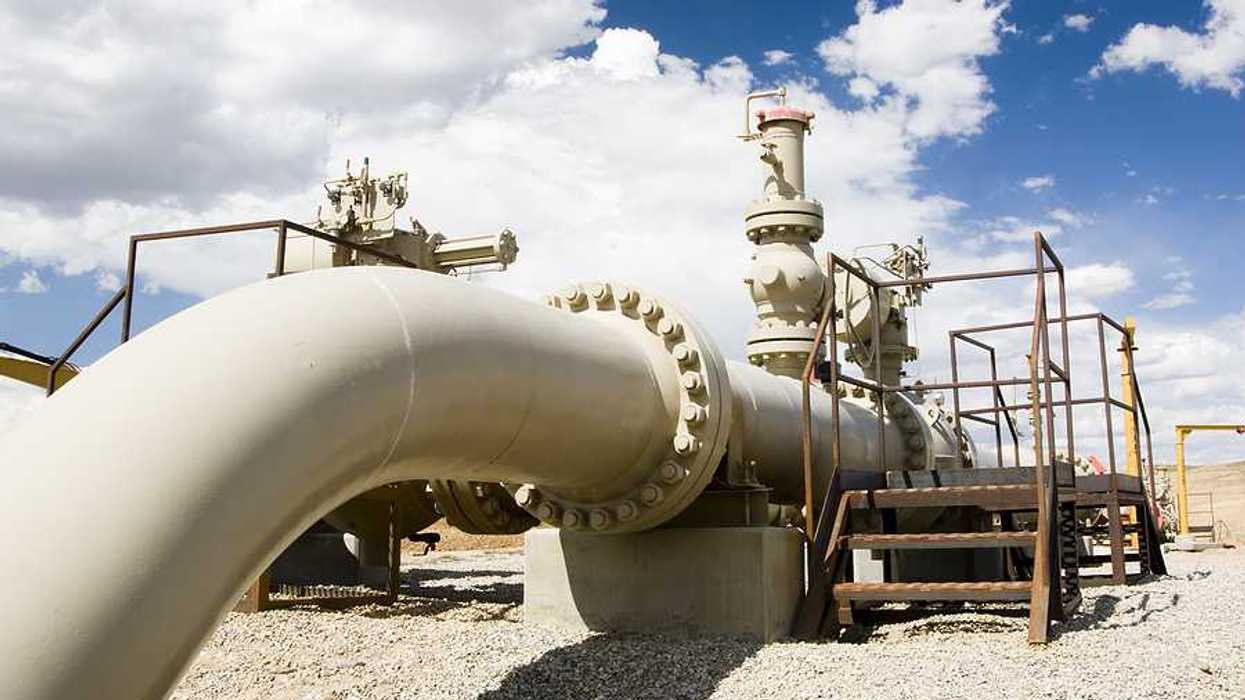 A gas pipeline stretching across a desert landscape