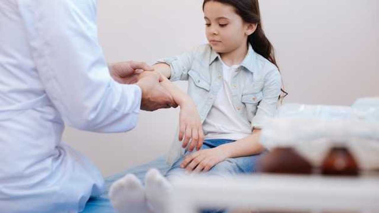 A girl being examined by a doctor