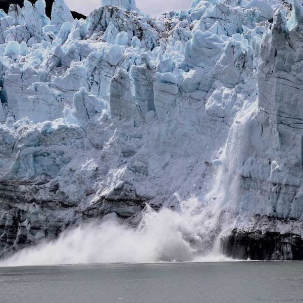 A glacier calving into sea