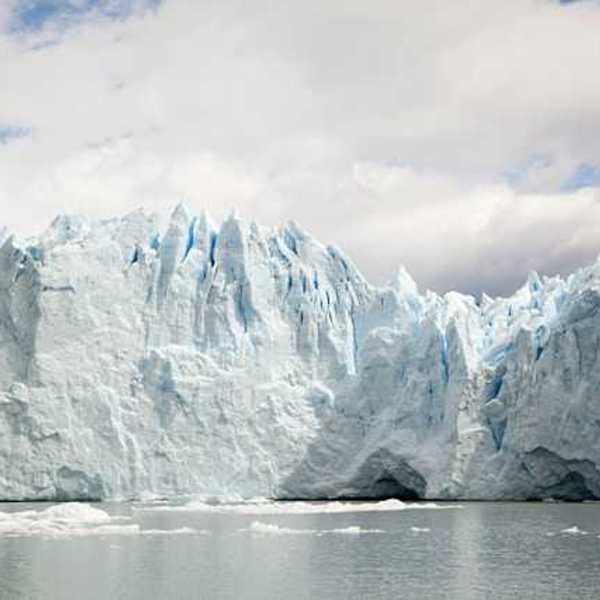 A glacier looming over a body of water