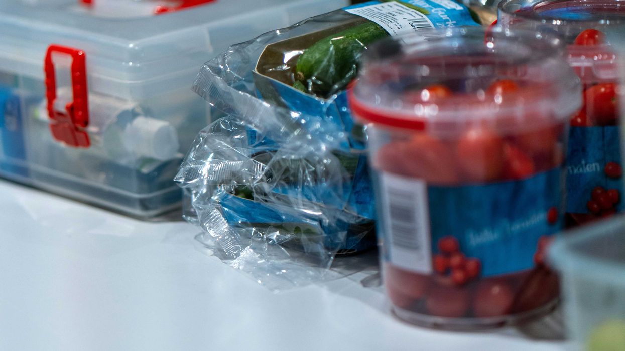 a group of plastic containers with food in them.