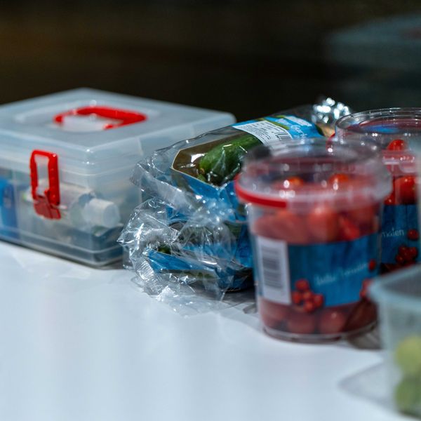 a group of plastic containers with food in them.