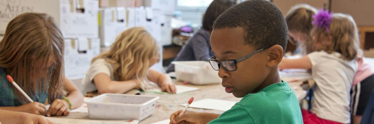 A group of students complete school work