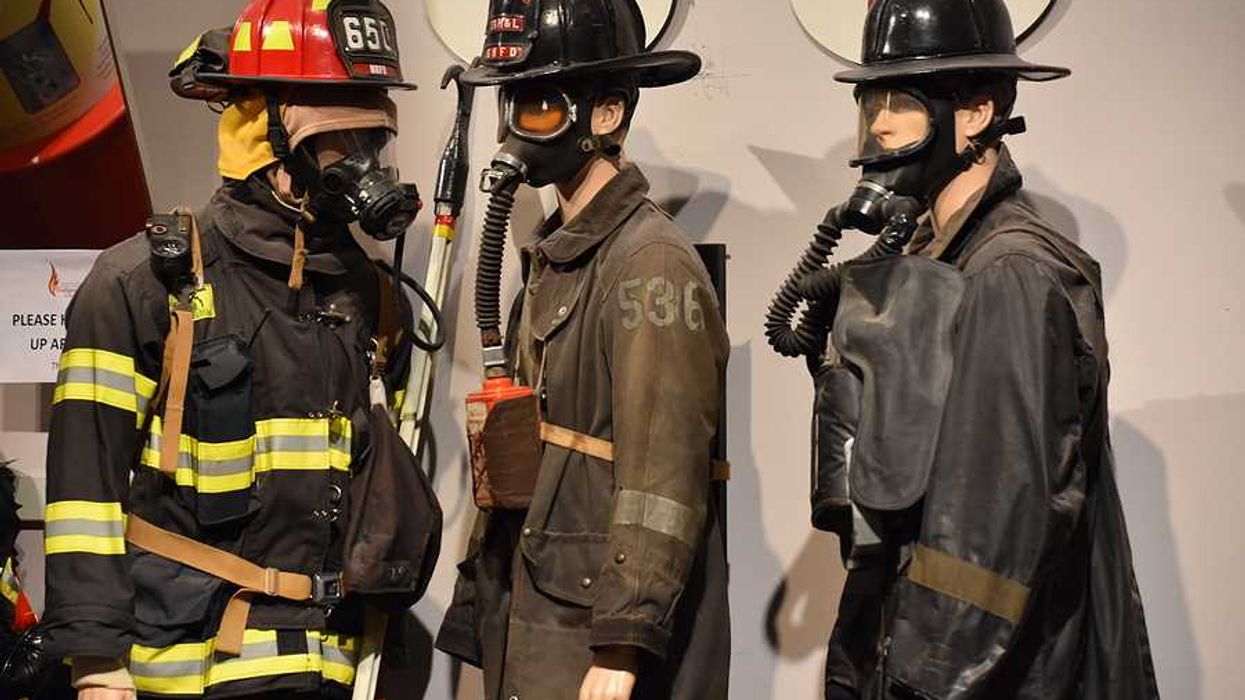 A group of three firefighter models wearing firefighting gear