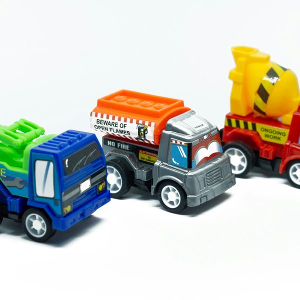 a group of toy trucks sitting next to each other