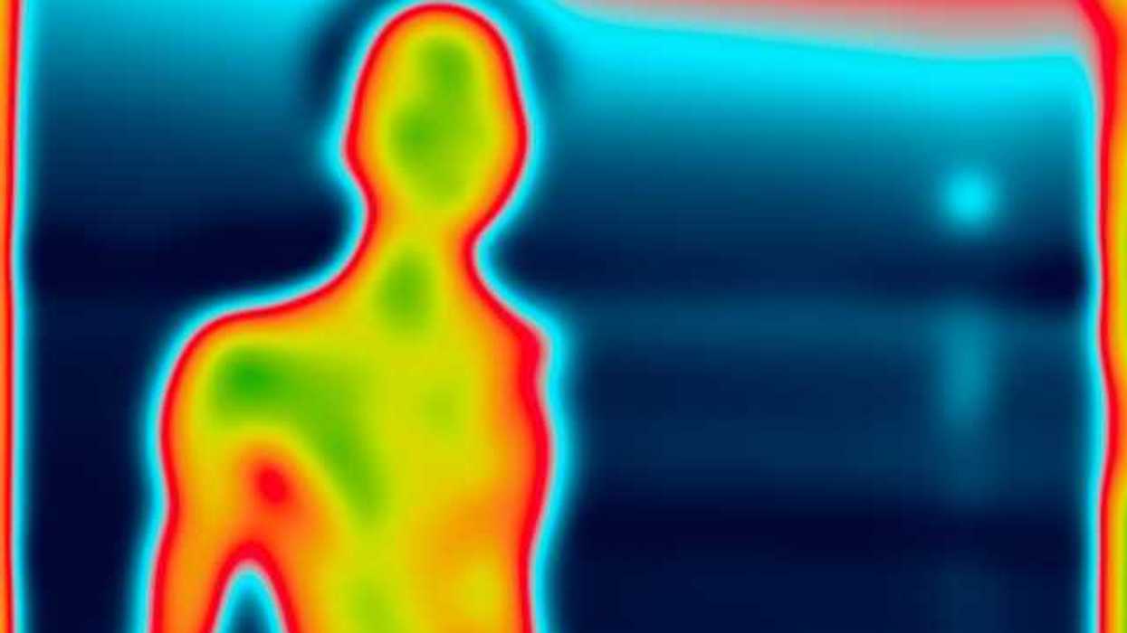 A heat image of a person silhouetted against a blue background